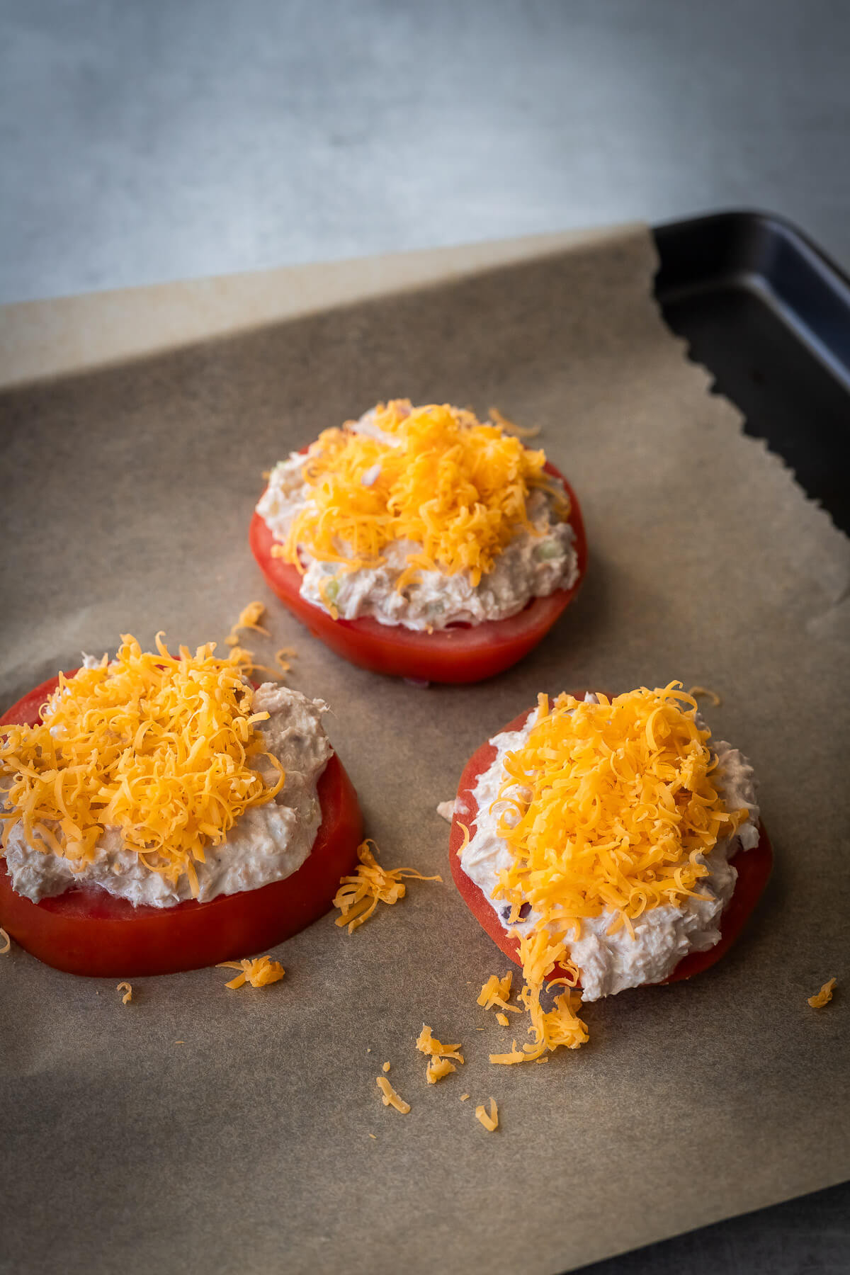 tuna melt tomatoes unbaked with cheddar cheese