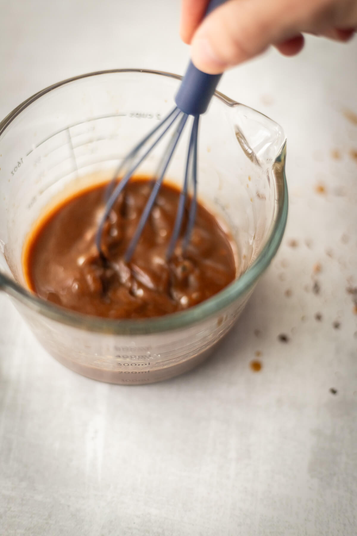 whisking together a gluten free stir fry sauce