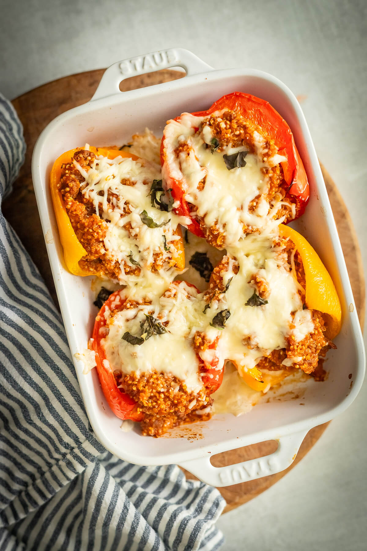 beef and quinoa stuffed peppers in a dish