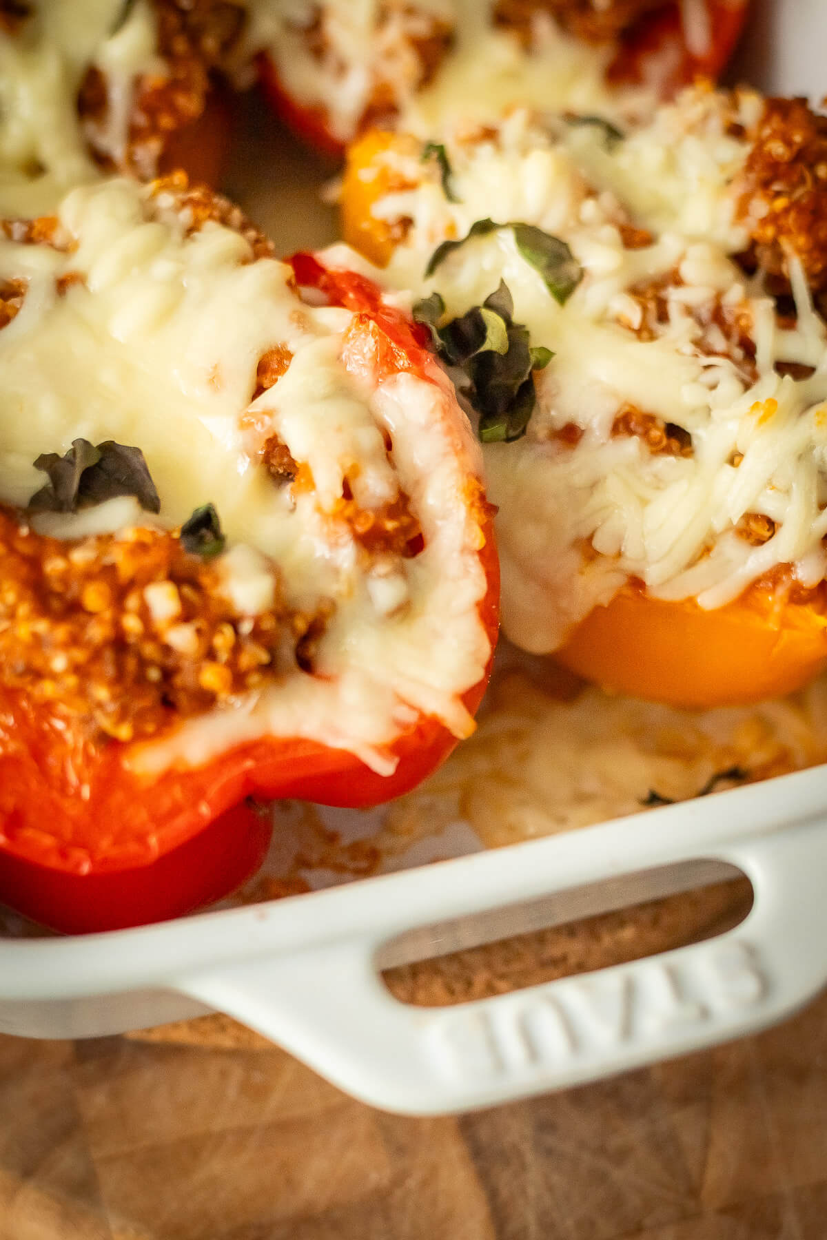 close up of beef and quinoa stuffed peppers in a dish