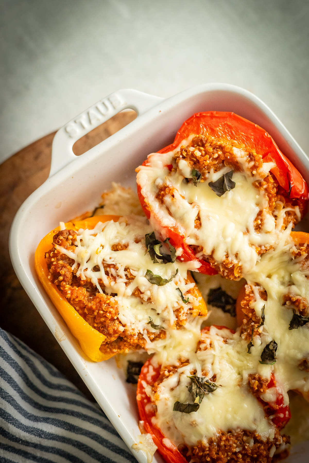 beef and quinoa stuffed peppers in a dish
